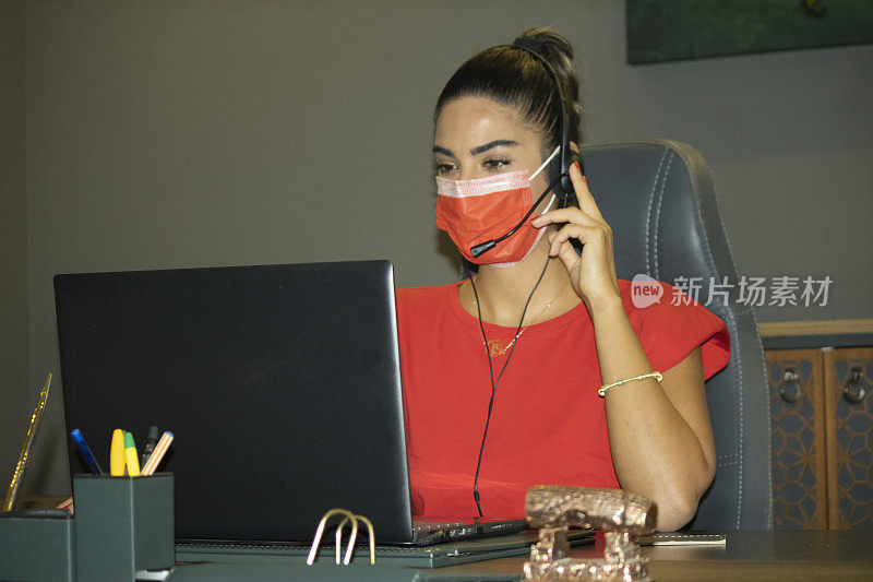 young girl working with the mask for the reason of covid 19